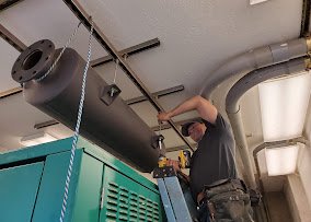 ZZ Electric technician working on generator equipment