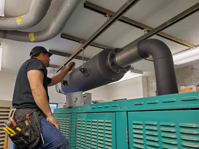 Electrician inspecting commercial generator equipment