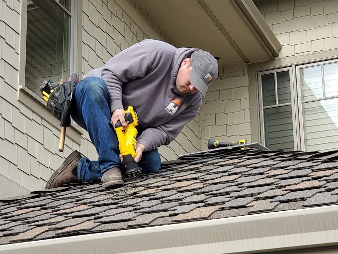 ZZ Electric technician working on exterior electrical equipment
