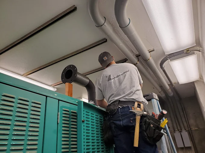ZZ Electric technician servicing generator equipment